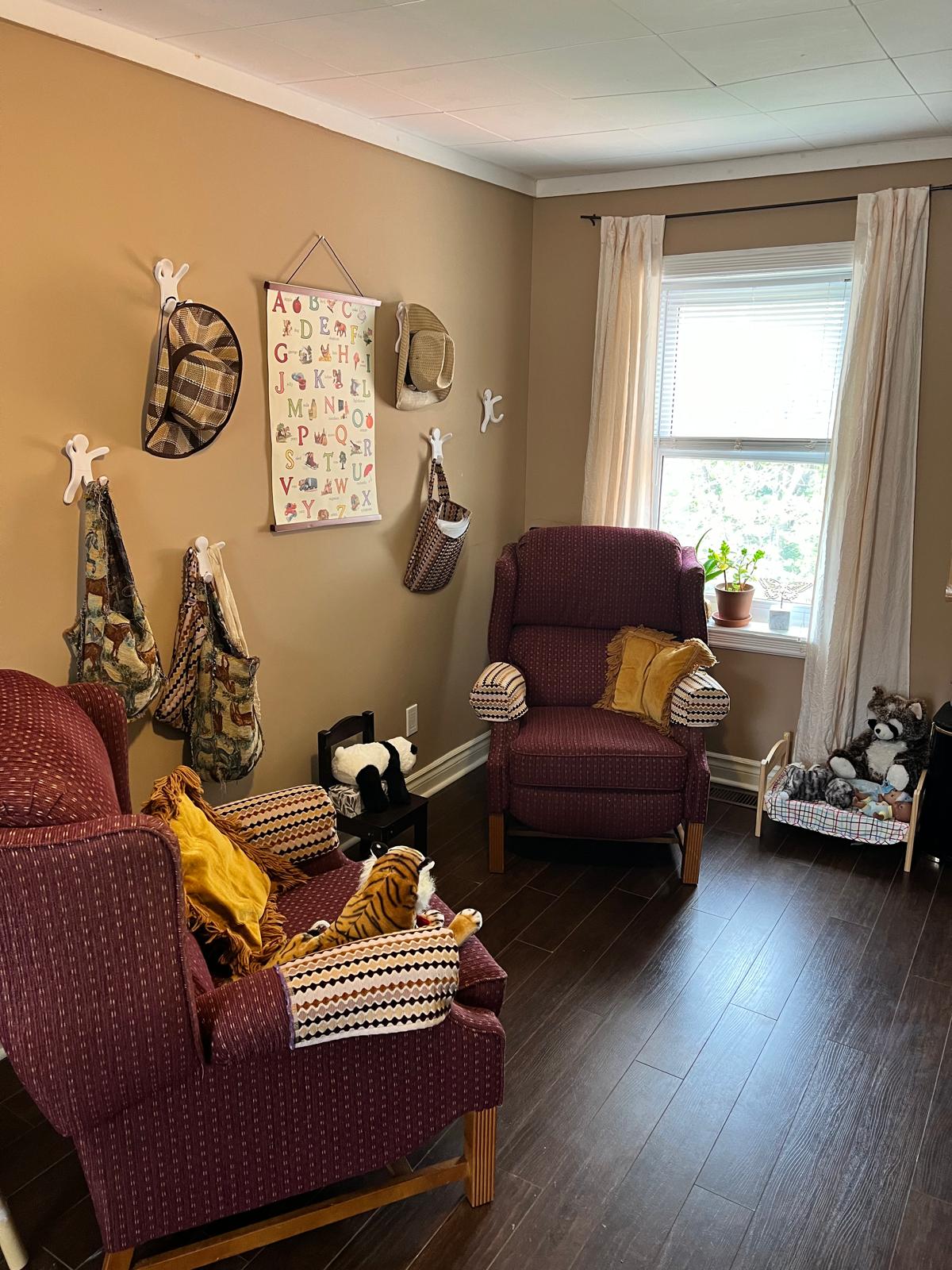 Therapy room seating area with warm decor